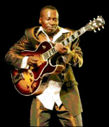 HAPPY: Selaelo Selota unvelied his new guitar at the Birchwood on Friday.  Pic. Pat Seboko. 09/07/2008. © Sowetan.