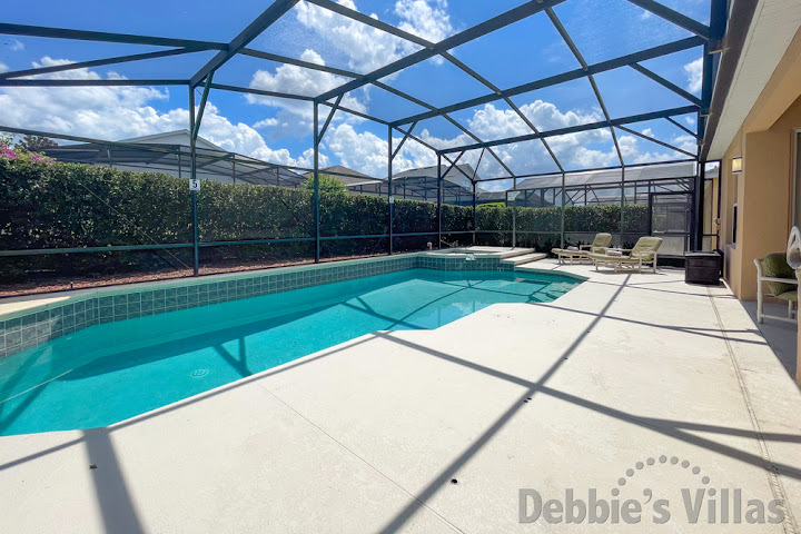 Sun-drenched secluded pool and spa deck at this Windsor Palms vacation villa