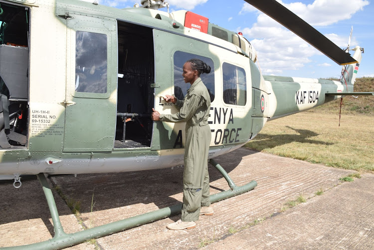 Senior sergeant Anne Mbaluka at work on one of the military aircrafts she services.