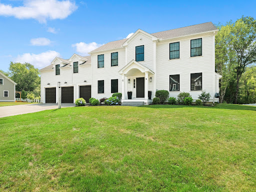 Buy this luxury property in Acton (United States) - Large white house with three-car garage