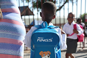 A Cosmo City Primary School grade 1 pupil heads off for the first day of the academic year on January 11 2023.