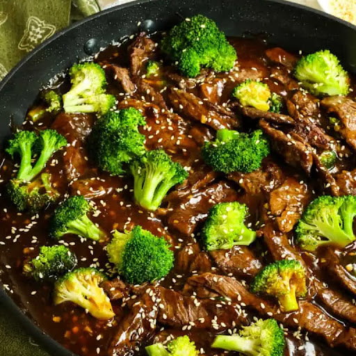 This Easy Beef and Broccoli is all made in one skillet, is so full of flavor, and is on the table in less than thirty minutes. Crisp stir-fried broccoli florets are paired with tender cuts of beef in a tasty salty-sweet Asian sauce.