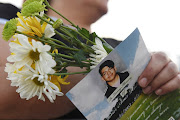 A woman holds a copy of the program at a vigil in honor of Javier Rodriguez, who was killed while shopping at Walmart, two days after a mass shooting at a Walmart store in El Paso, Texas, US August 5, 2019.  