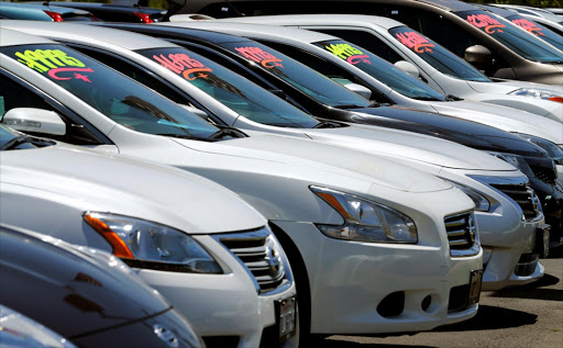 Vehicles line up to catch the customer’s eye at a car dealership.