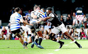 Lukhanyo Am of the  Sharks tackling Damian Willemse of  Western Province during the Currie Cup final  at  Kings Park in Durban on Saturday. Centre Am was called up for the Springbok end-of-year tour. / Steve Haag/Gallo Images