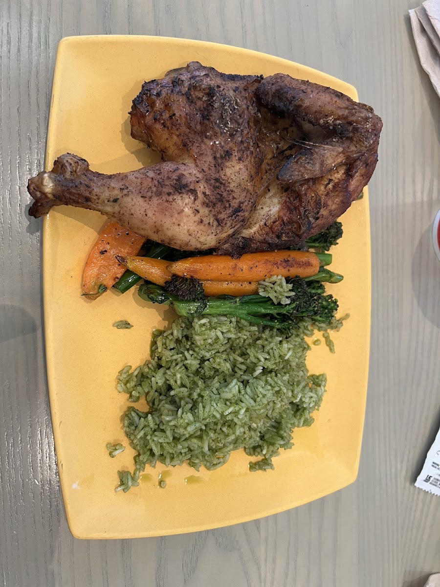 Roasted half chicken with side of cilantro rice and veggies