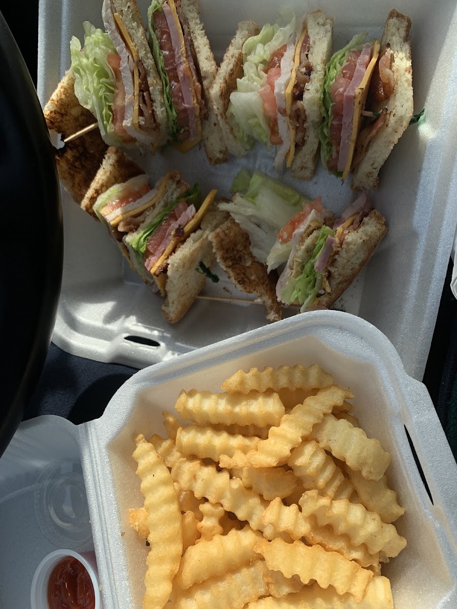 Turkey, ham, cheddar club sandwich. But and filling w/ fries. Uses Rumi’s GF bread and they have a separate fryer for the fries.