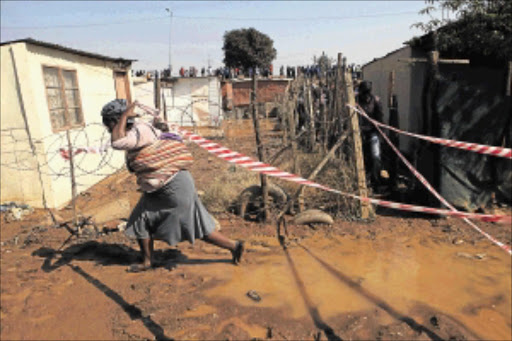 CRISIS: More than 800 people were evacuated from Phomolong informal settlement in Mamelodi, east of Pretoria, last Monday when a main water supply pipe burst, damaging residents' homes and raising tensions in the area. PHOTO: ALON SKUY