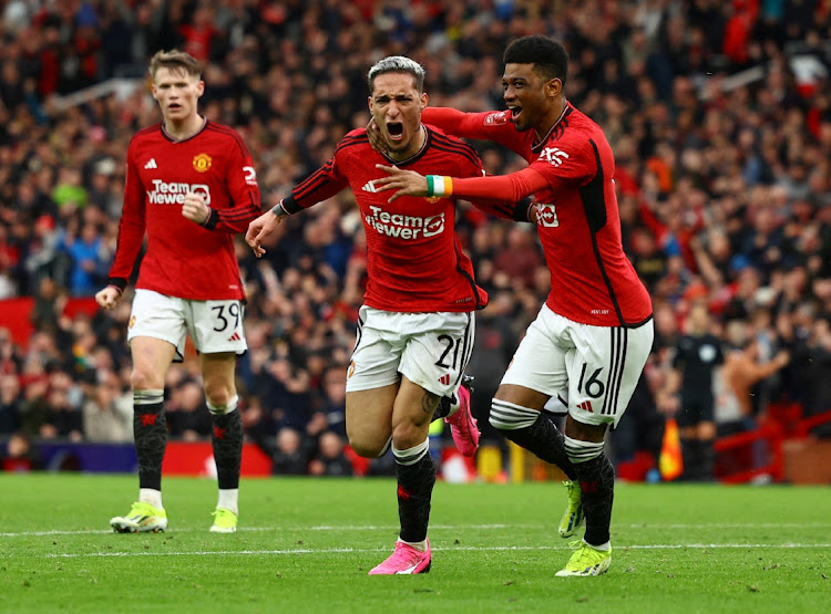 Manchester United's Antony celebrates scoring their second goal with Amad Diallo in their FA Cup quarterfinal win against Liverpool at Old Trafford in Manchester on Sunday.