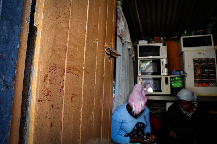 Elvis Nyathi's blood on the door of his home in Diepsloot, Johannesburg. Nyathi was killed and set alight by a mob allegedly targeting Zimbabweans in the township. File photo.