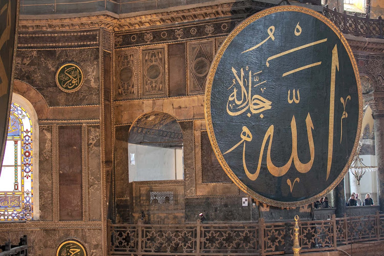 Signage with a passage from the Koran inside Hagia Sophia in Istanbul. 