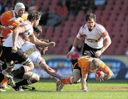 BREAKING THROUGH: The Cheetahs' Sarel Pretorius on the attack 
      
       against the  Golden Lions  at Ellis Park  in Johannesburg on Saturday
      Photo: Gallo Images