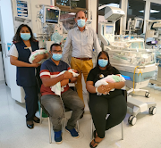 First-time parents Amrish Surujballie and Sarika Srikisoon with their newborn triplets who were born on their mother's birthday on May 4 2022. With the parents are Sushie Odayar, the maternity unit manager, and paediatrician Dr Jonathan Grey Egner who assisted in the birth of the babies. 