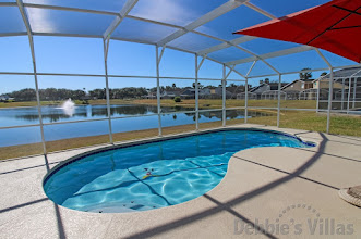 Hampton Lakes villa in Davenport with a lake view from the south-facing pool deck.