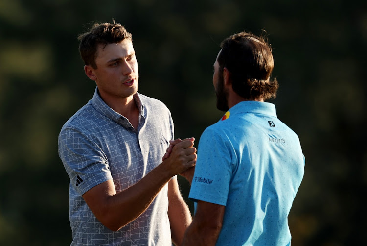 Sweden's Ludvig Aberg shakes hands with Max Homa of the US on the green on the 18th hole after completing their final round at the Augusta National Golf Club in Augusta, Georgia, the US, April 14 2024. Picture: REUTERS/Eloisa Lopez