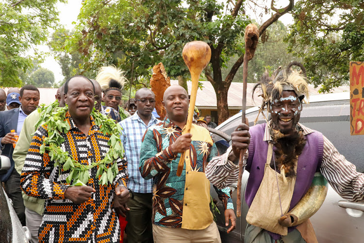 Governor Wilber Ottichilo Senator Godfrey Osotsi dancing with Banyore elders at ebusakami primary