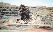 A new venture would use large stockpiles of iron ore tailings. 30/07/07. © Unknown.

EXPLOSIVE: Iron ore operations at Sishen.