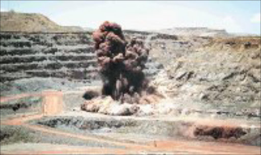 A new venture would use large stockpiles of iron ore tailings. 30/07/07. © Unknown. EXPLOSIVE: Iron ore operations at Sishen.