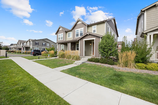 Modern house facade with manicured lawn in this luxury house for sale in Erie ($555,000)