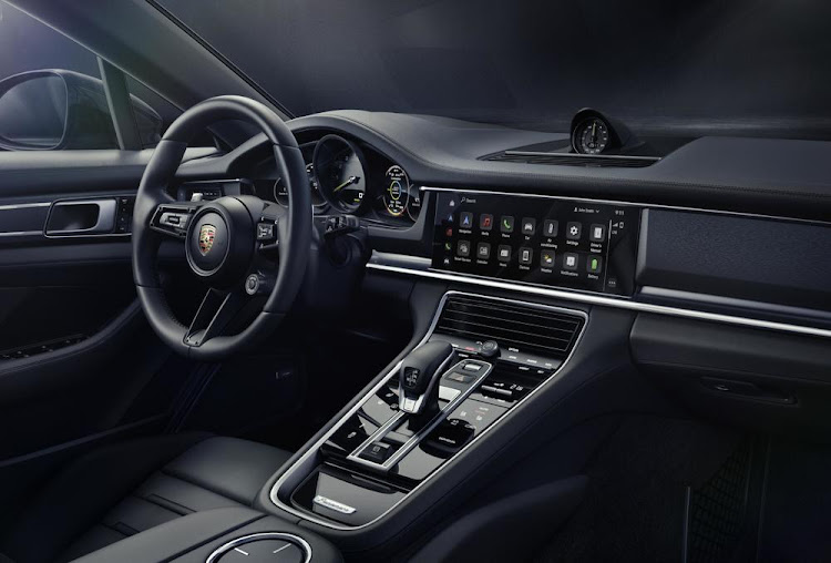 Drivers of the exclusive edition sit on black, leather-clad and heated 14-way electric adjustable seats with a memory package and the Porsche crest on the headrests.