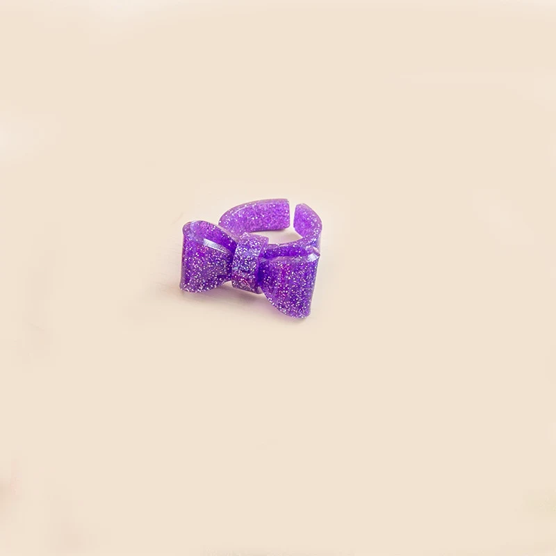 Title 14, Anello a fiocco color caramella, apertura regol...