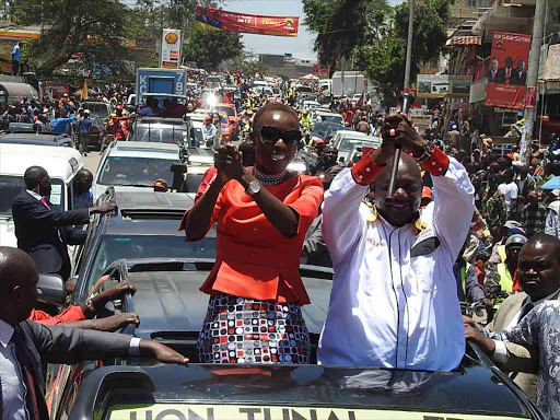 Narok Deputy Governor Evalyn Aruasa and Governor Samuel Tunai lead a procession to a rally at at Narok stadium, March 20, 2017. /KIPLANGAT KIRUI