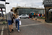 Black Friday shoppers queue at Woodmead Value Mart in Johannesburg on November 26 2021.