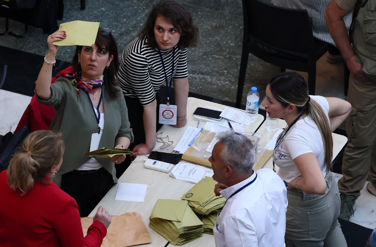 Election officials count votes from abroad on the day of Turkey's presidential and parliamentary elections, in Ankara, Turkey, May 14 2023. Picture: YVES HERMAN/REUTERS