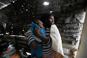 A WEEK FROM HELL:  Siphokazi Mvumbi and her two-month-old son, Mnqubi, have been hit badly this week. A fire destroyed their home in Sydenham's Foreman Road informal settlement. Mvumbi has rebuilt her house, but has since had to contend with heavy rain that  battered KwaZulu-Natal.