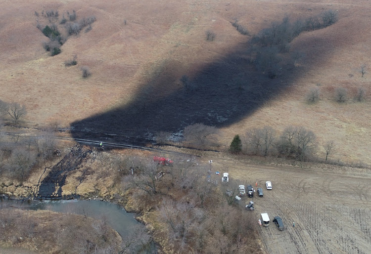 Emergency crews work to clean up a crude oil spill in rural Washington County, Kansas, US, in this December 9 2022 file photo. Picture: REUTERS/DRONE BASE