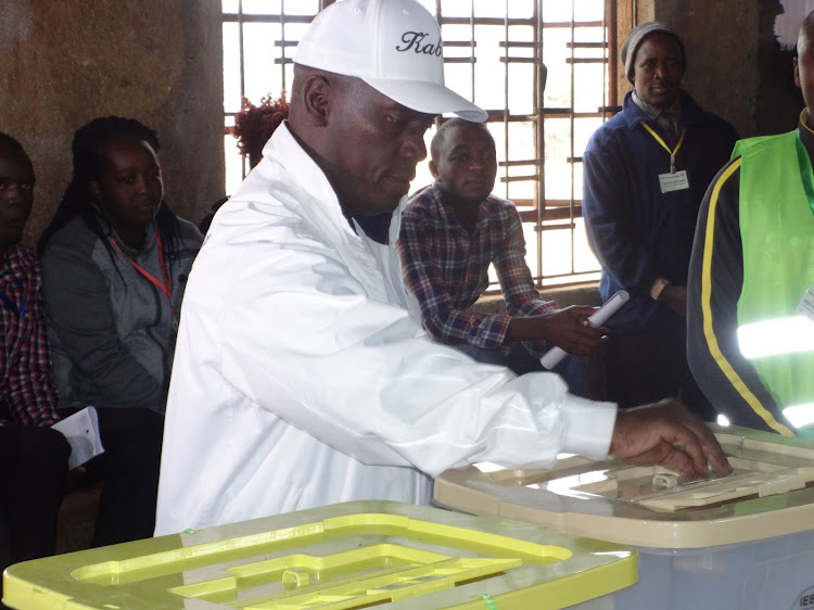 Former Kiambu Governor William Kabogo casts his vote at St George primary School in Ruiru town in 2017.