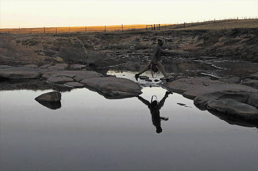 A man makes his way to work in Qunu, former president Nelson Mandela's home village in the Eastern Cape