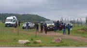 A group of Jacob Zuma supporters gather outside the home of the former president for a thanksgiving party.