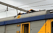 The body of an electrocuted man on top a train near Philippi station in Cape Town on Wednesday January 23 2019.