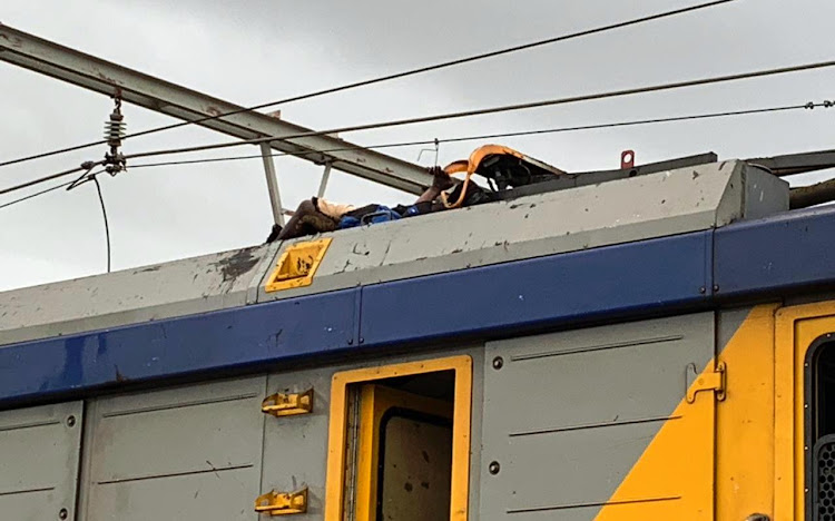 The body of an electrocuted man on top a train near Philippi station in Cape Town on Wednesday January 23 2019.