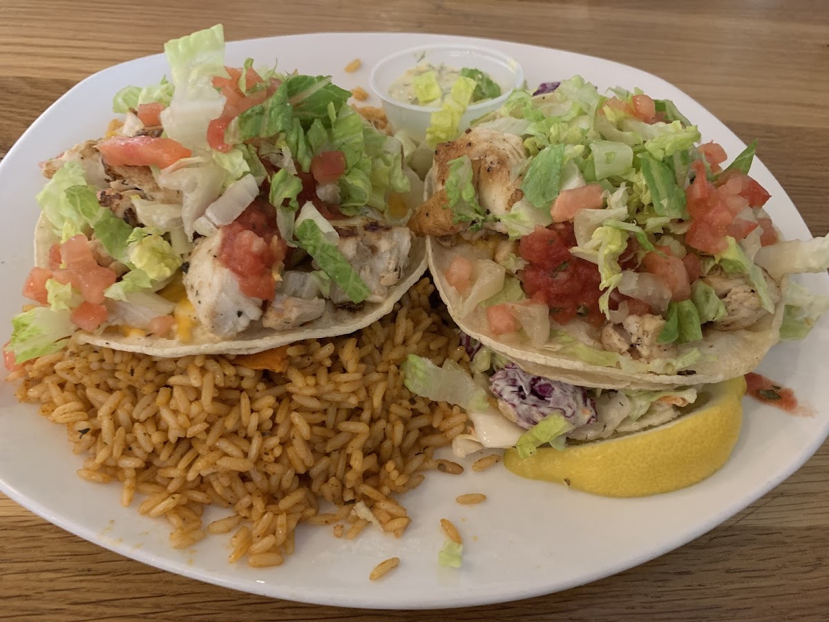 Dinner fish taco platter with rice and coleslaw. The slaw was very refreshing with dill and seemed more like a salad than coleslaw.