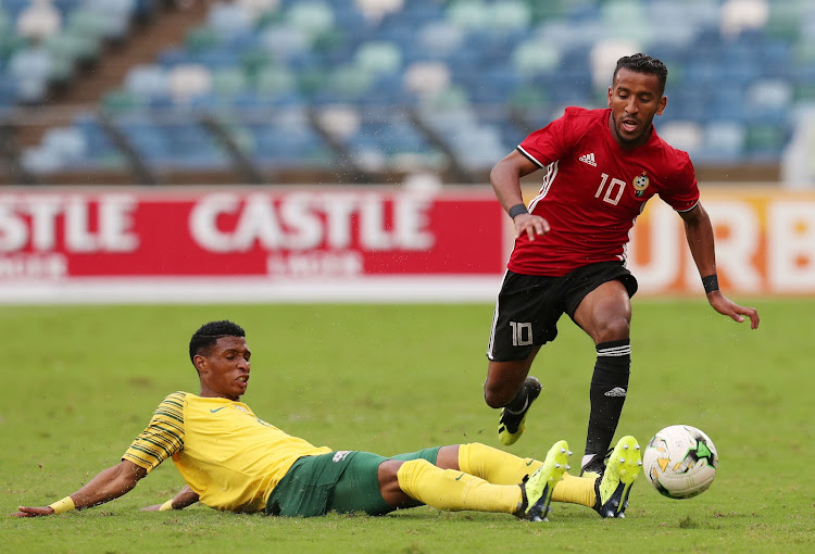 Bafana Bafana debutant Vincent Pule (L) tussles for the ball with Hamdou Elhouni (R) of Libya during the 2019 African Cup Of Nations qualifier at the Moses Mabhida Stadium, Durban on September 8 2018.