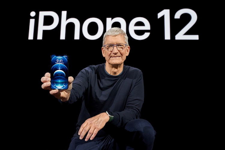 Apple CEO Tim Cook poses with the all-new iPhone 12 Pro. Picture: BROOKS KRAFT/APPLE