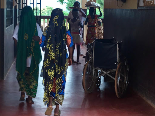 Girls walking in the corridors of the Catholic Hospital Complex of Batouri , Eastern Cameroon, July 4, 2017. /THOMSON REUTERS FOUNDATION