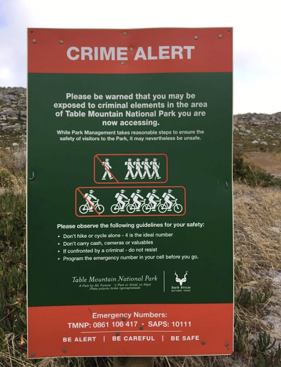 A safety sign on Table Mountain National Park's high-risk trails. An alleged mugger fell to his death while fleeing after being pepper-sprayed by one of his hiker victims near Camps Bay. File photo.