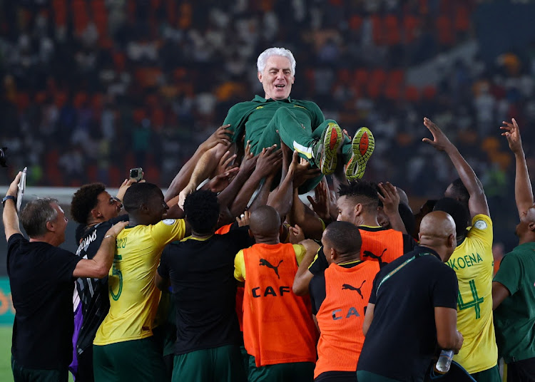 Bafana Bafana players celebrate with coach Hugo Broos after winning the penalty shootout to earn the bronze medal in their Africa Cup of Nations third place playoff against Democratic Republic of the Congo at Stade Félix-Houphouët-Boigny in Abidjan, Ivory Coast on Saturday night.