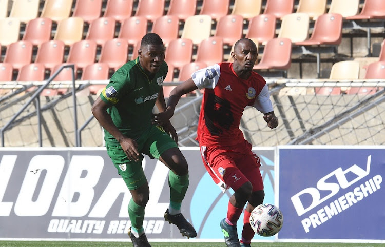 Manuel Kambala of Baroka FC challenges Thabo Rakhale of Tshakhuma Tsha Madzivhandila FC during the DStv Premiership match between Baroka and Tshakhuma FC at Peter Mokaba Stadium on Tuesday May 18 2021 in Polokwane.