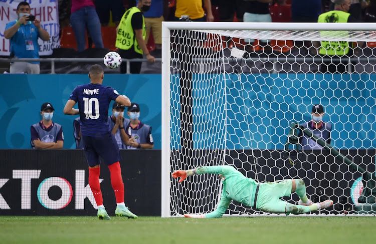 Kylian Mbappe watches as his penalty is saved by Switzerland's Yann Sommer during the shoot-out.