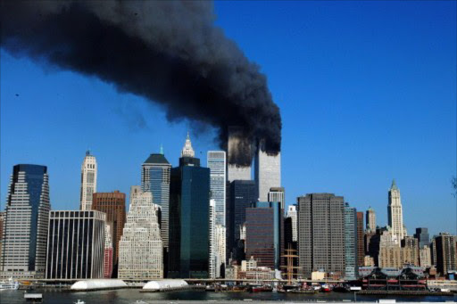 The twin towers of the World Trade Center billow smoke after hijacked airliners crashed into them early September 11 2001. The terrorist attack caused the collapsed of both towers. File photo.