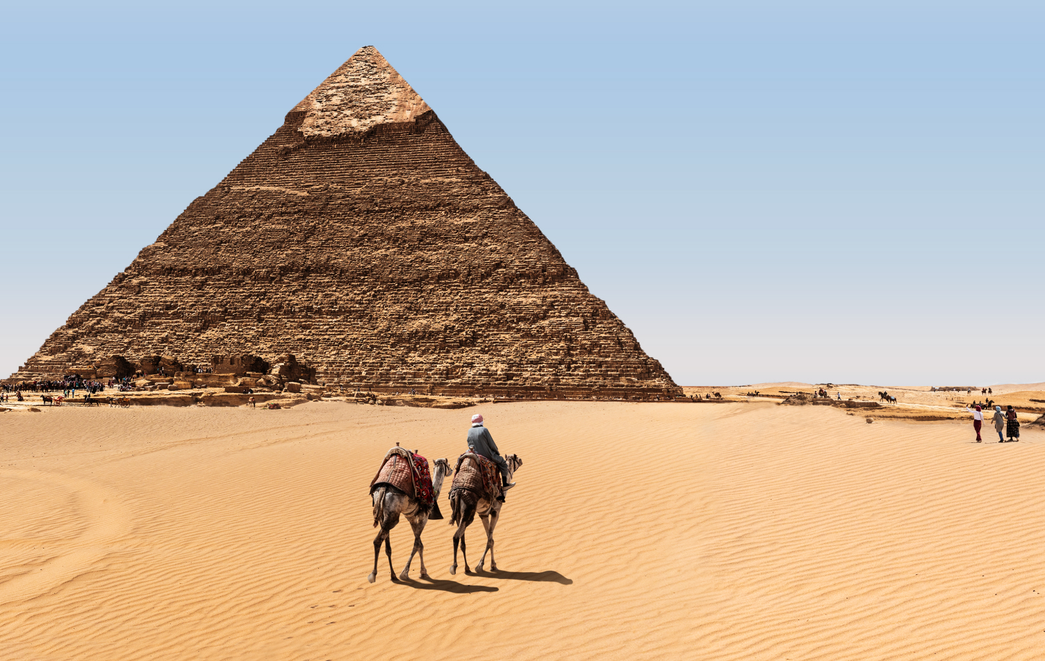 The Pyramids and bedouins in the desert of Giza, Egypt