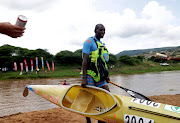 Thulani Mbanjwa finishes on the first day of the Dusi Canoe Marathon at KwaXimba.