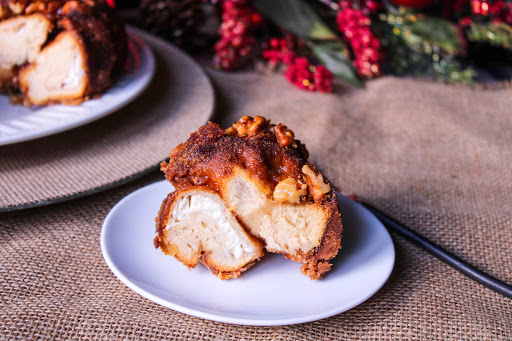 A piece of Christmas Monkey Bread on a plate.