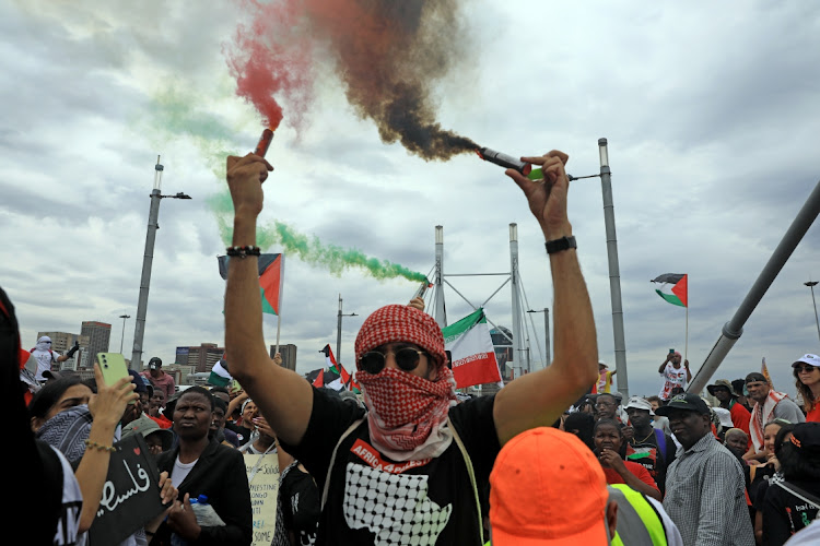 Thousands of people march through Johannesburg on November 29 2023, to mark the International Day of Solidarity with the Palestinian People.