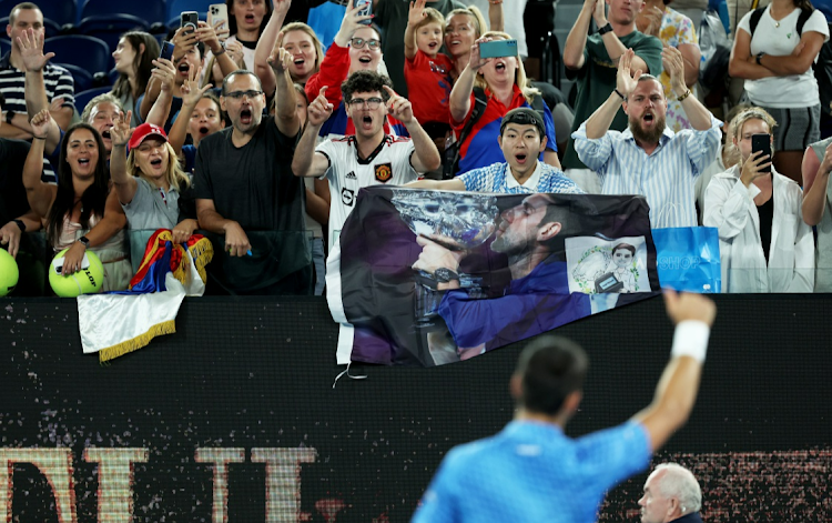 Novak Djokovic of Serbia celebrates with the crowd after his victory in his round one singles match against Roberto Carballes Baena of Spain on day two of the 2023 Australian Open at Melbourne Park on January 17 2023.