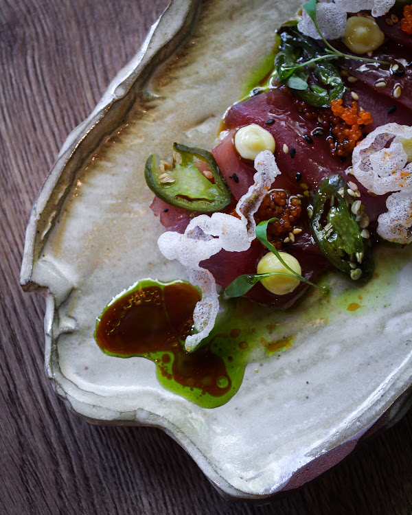 Tuna ceviche with smoked jalapeno, shoyu, and coriander oil.